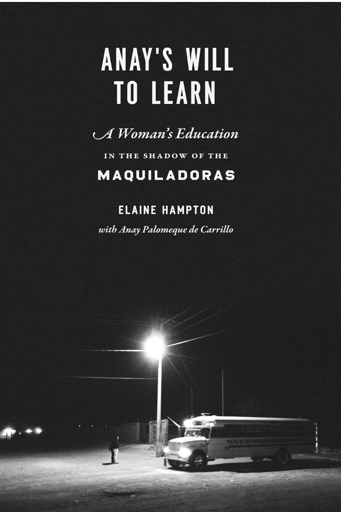 Black-and-white book cover with title text above a night scene of a bus, streetlamp, and lone person.